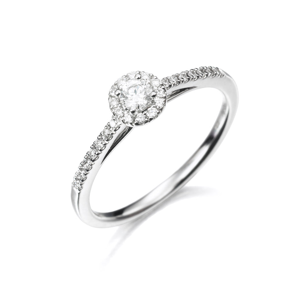 Anillo de oro 18K con diamantes en orla 0.26cts